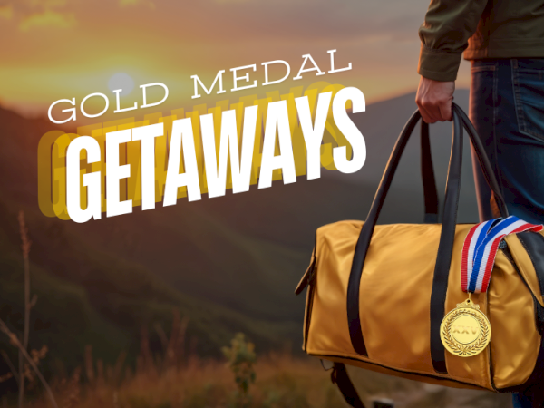 Gold Medal Getaways: a traveler&rsquo;s bag ready for adventure, sunrise backdrop, and a hanging gold medal&mdash;dream trips start here.